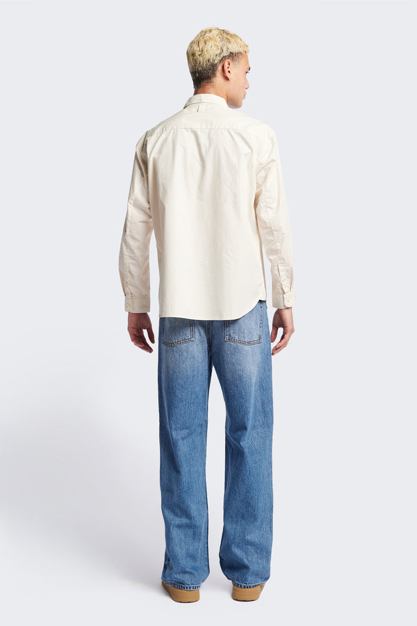 Back of the Iberia Long Sleeve Shirt in Ecru, featuring a built-in collar, semi-concealed placket, and a curved hem. Available in XS, S, M, L, XL