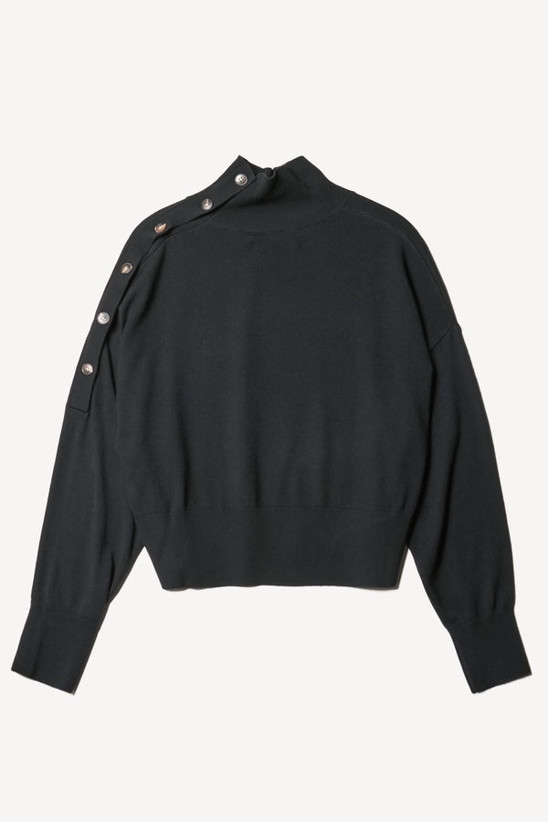 Flat back view of the Impart merino wool mock neck sweater with shoulder button detail in black.