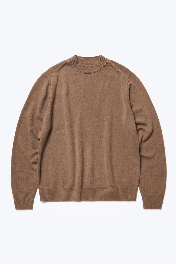 The front of the Photic Cashmere Sweater, a relaxed crew-neck jumper with exposed linked seams at the shoulders and knitted in a wool/cashmere blend in Brown. This sweater is light, warm and soft.