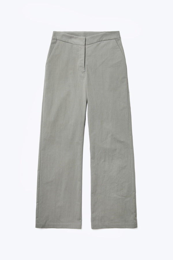 The front of the Grace Pant, a slim, straight leg pant with mid-rise waistline. Crafted from a transcendent linen-cotton blend in grey and finished with gently angled side pockets.