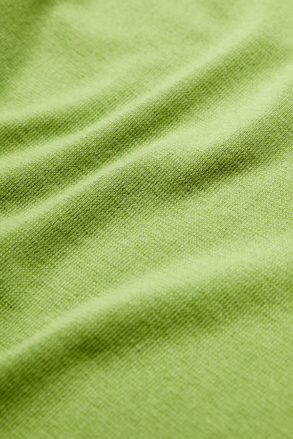The Monument Mock Neck Sweater is knitted in Merino wool in Apple Green for a luxurious feel.
