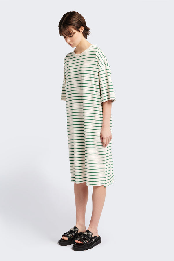 The Nadir Dress is a laid back style and made from pure cotton jersey. This knee-length dress features green stripes and is the perfect summer throw on style.