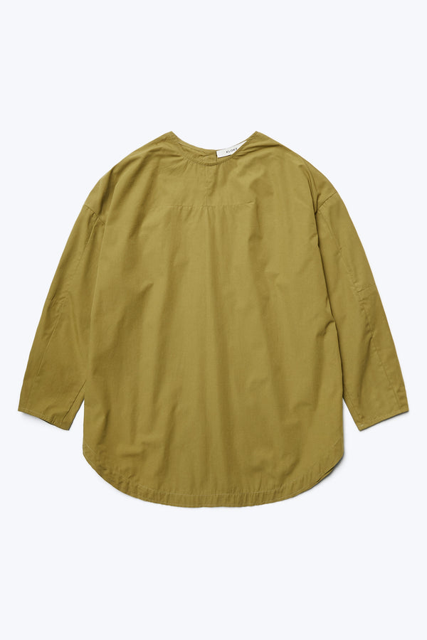 The Plateau Blouse Moss Green is a relaxed silhouette shirt with long sleeves, darted seam details and rounded scoop hem.