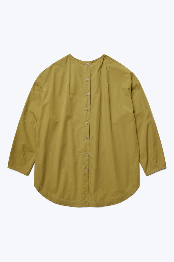 The Plateau Blouse Moss Green features a button through back placket and rounded scoop hem.