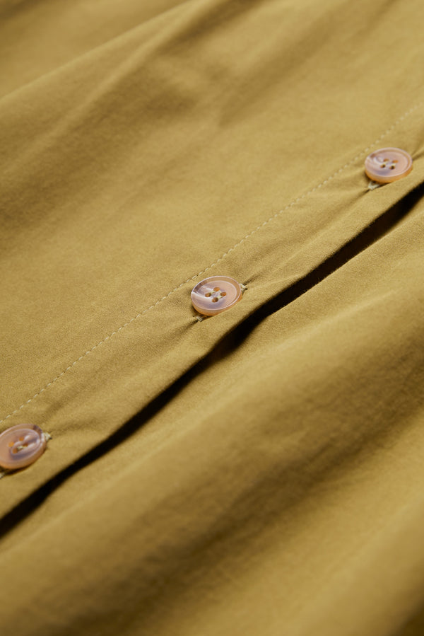 The Plateau Blouse Moss Green has a button through back placket.