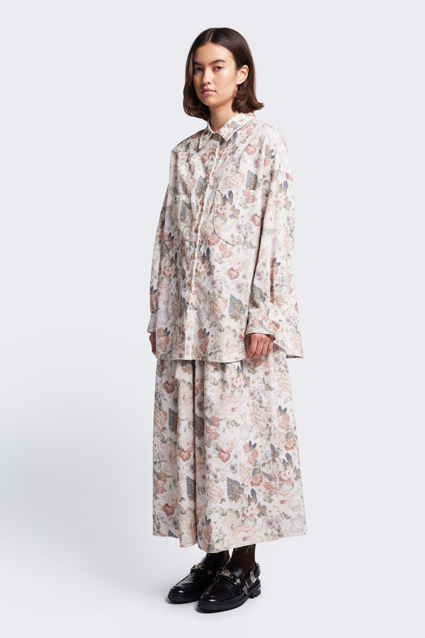 The Resting Cord Shirt Floral is a button up shirt with a relaxed silhouette, front patch pockets at the chest, stand collar and scoop hem. Made from a fine wale corduroy.