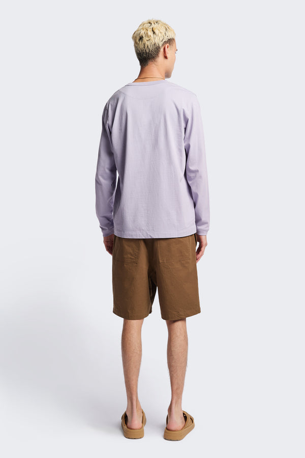 Back of The Degree Pleat Short, a laidback and adaptable easy to weather summer short. Crafted in a brown washed cotton herringbone twill. Available in 5 sizes.