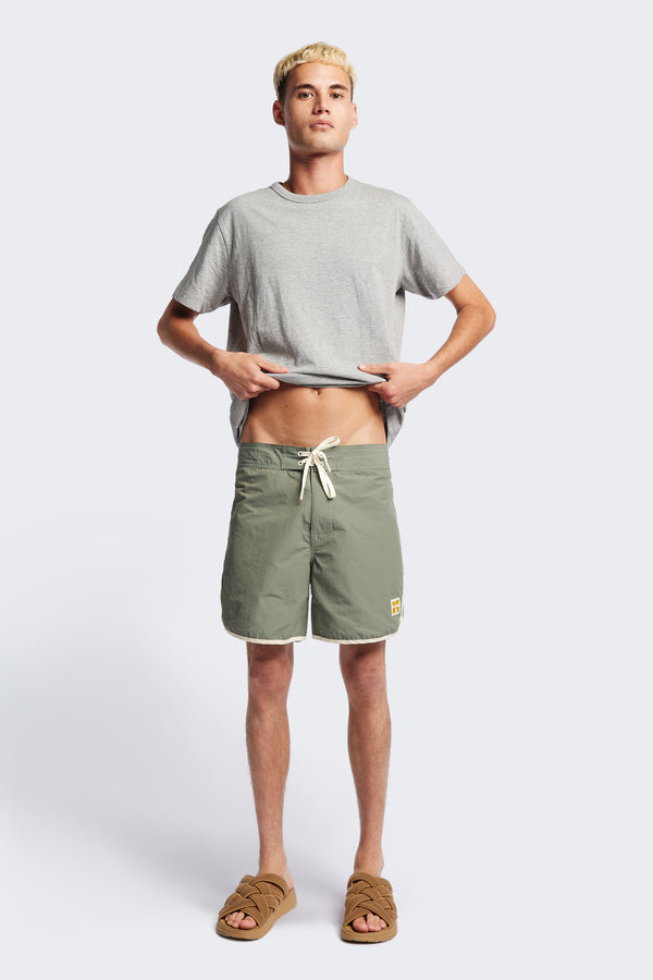 The Hybrid Board short in Sage Green, made from a functional technical cotton/nylon thats durable, stashable and quick-drying. Featuring back patch pocket with Velcro closure. Available in 5 sizes.