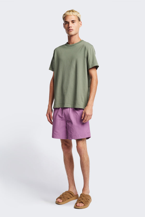 The New Wave Short in Purple Fade. With Utilitarian features like an elastic drawstring waist, internal mesh support, front slant pockets, and back patch pocket. Available in 5 sizes.