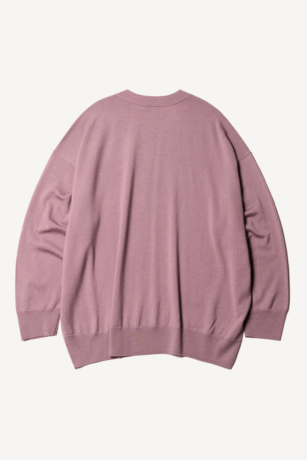 Flat Back the Pitch loose fit merino wool crew neck sweater with exposed seams in mauve.