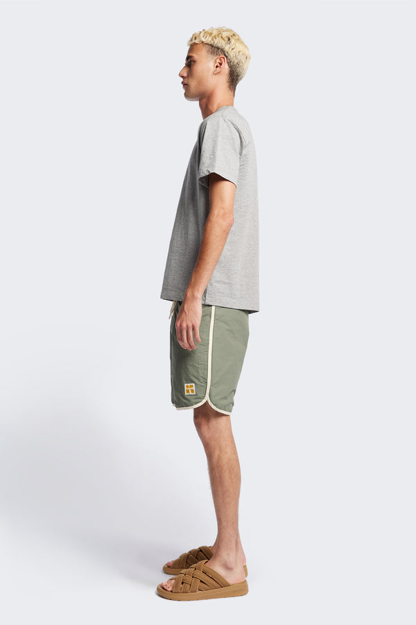 Side of The Radius T-Shirt is a traditional men's tee with 1 x 1 rib-bound cover-stitched neckline that's reinforced at the back. Made from 100% organic cotton in Heather Grey. Available in 5 Sizes.