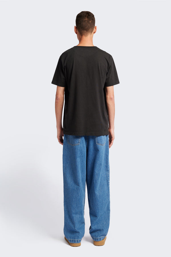 Back of The Stratus Henley T-shirt in Vintage Black. Garment-dyed in soft cotton jersey with three-button placket and coverstitched hems. Available in 5 sizes.