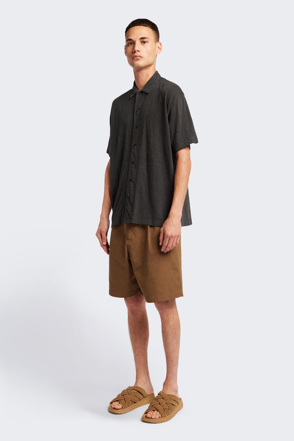 Front of The Tectonic Shirt in vintage black, a classic boxy fit T-Shirt made from 100% cotton garment dyed jersey with a reinforced back yoke. Available in 5 sizes.