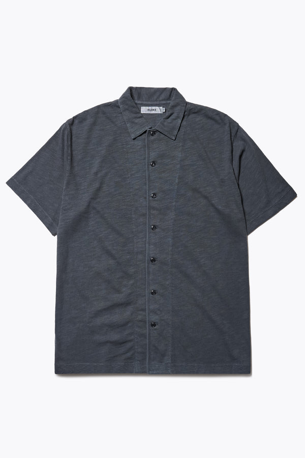 The Tectonic Shirt in vintage black, a classic boxy fit T-Shirt made from 100% cotton garment dyed jersey with a reinforced back yoke. Available in 5 sizes.
