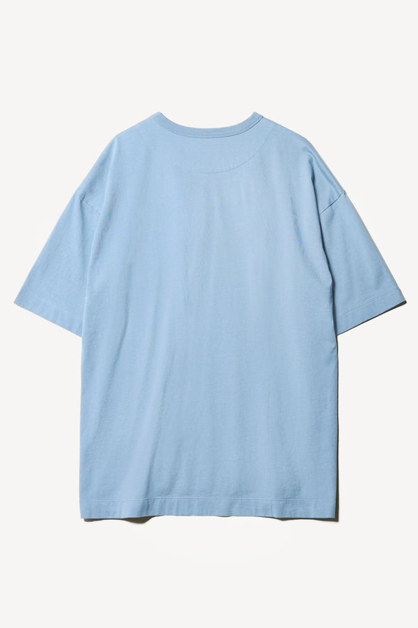 Flat Back of the Monolith Unisex Tee in Blue. Oversized relaxed fit. Available in 6 sizes. Made from 100% Organic Cotton.