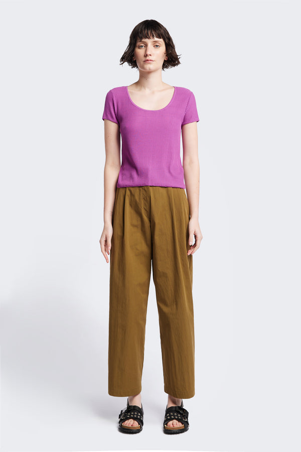 Celsius Knit T-Shirt in Fuchsia Pink, ribbed with a shallow scoop neckline, small cap sleeves, and slim fit. Made from 100% Tencel. Available in 5 sizes.
