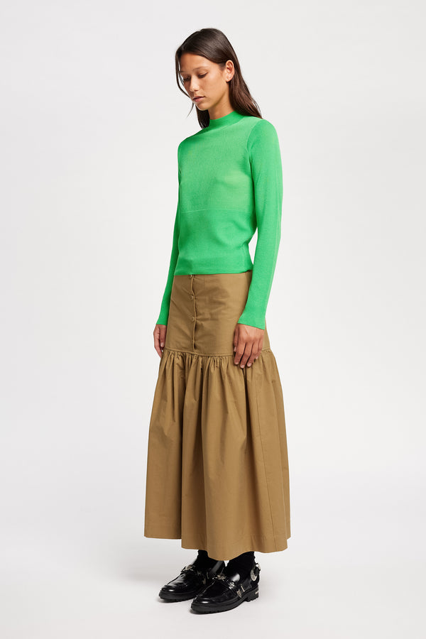 Front angle view on Model of the Clarity fitted crew-neck knit top in Vivid Green