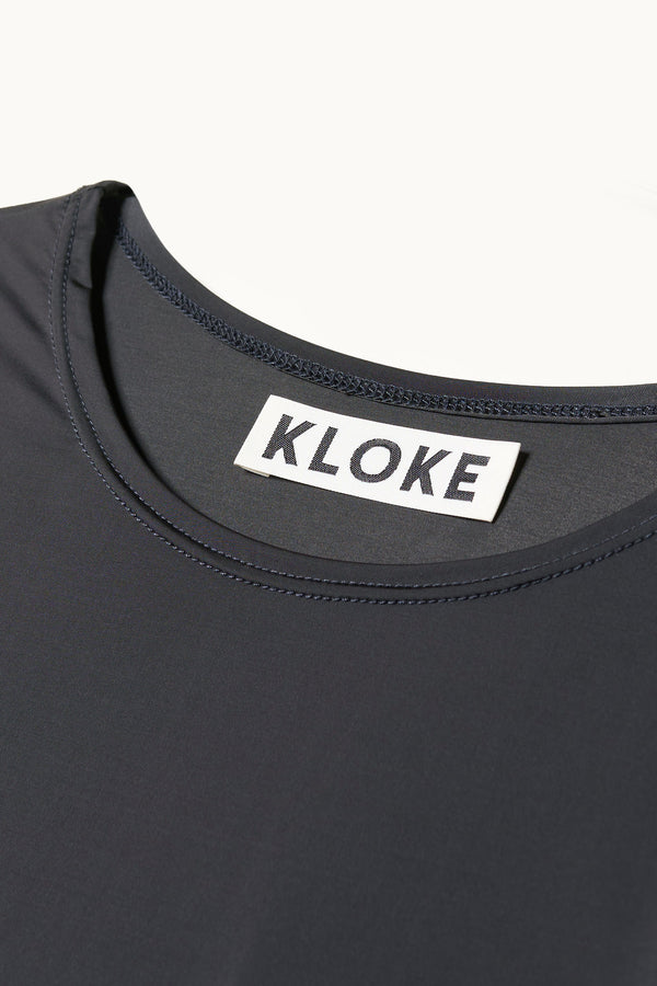 Close up fabric shot of Jet Black Convoy short sleeve fitted top in recycled poly with slim silhouette and classic crew neckline