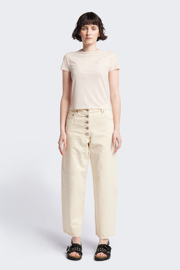 Front of the Delphi Jean in mid ecru, featuring a wide leg that tapers at the ankle, with an exposed button fly and Kloke-branded hardware. Available in 10 sizes.