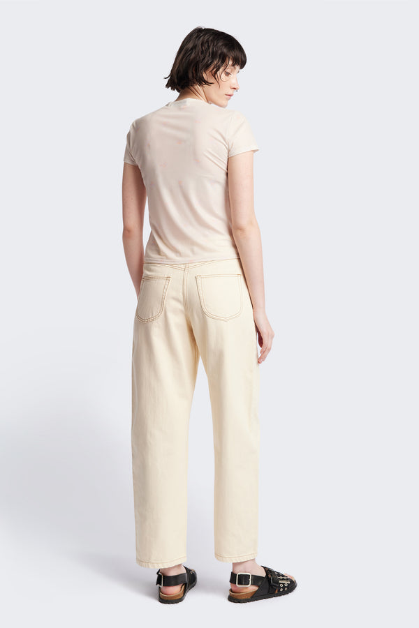Back of the Delphi Jean in ecru, featuring a wide leg that tapers at the ankle, with an exposed button fly and Kloke-branded hardware. Available in 10 sizes.