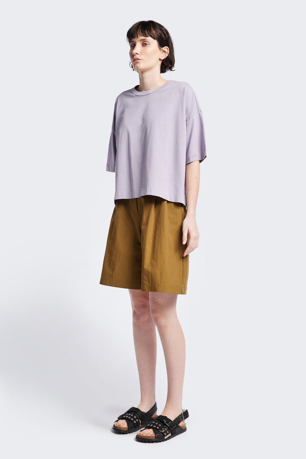 Tailored Depth Short in Olive Brown, crafted from soft cotton with pleat front detail, slant pockets, and a relaxed wide leg. Finished with back dart detailing and patch pockets. Available in 6 sizes.