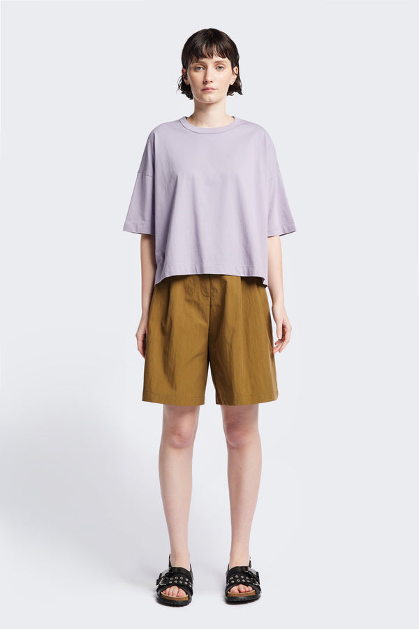 Tailored Depth Short in Olive Brown, crafted from soft cotton with pleat front detail, slant pockets, and a relaxed wide leg. Finished with back dart detailing and patch pockets. Available in 6 sizes.