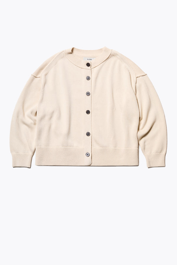 Flow Cardigan in Ecru Beige , relaxed boxy cardigan in soft cotton yarn with a crew neckline, button closure, and exaggerated dropped shoulders. Available in 5 sizes.