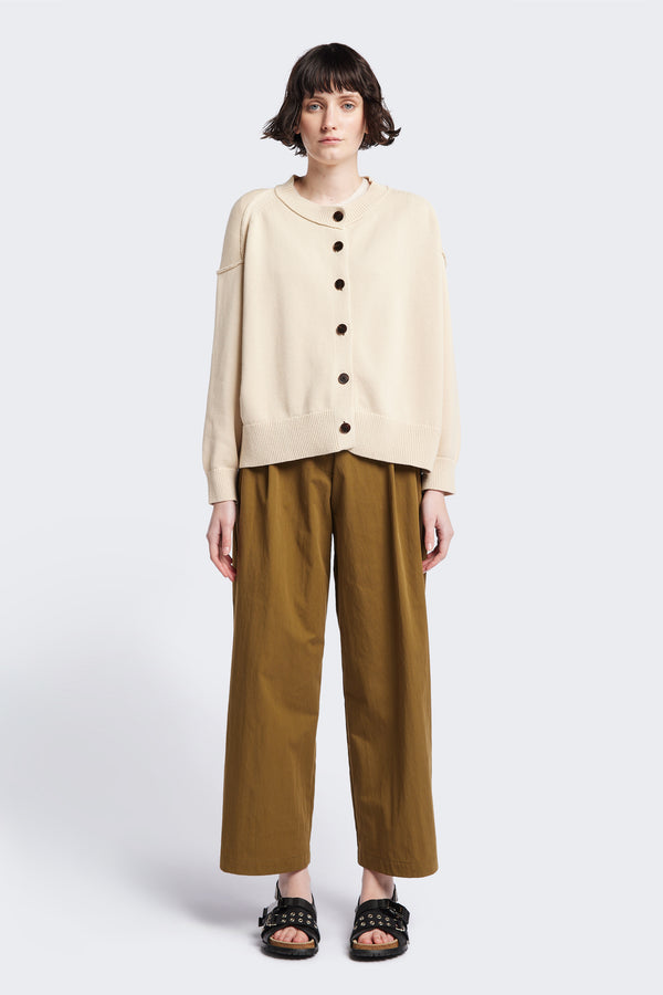 Flow Cardigan in Ecru Beige , a relaxed boxy cardigan in soft cotton yarn with a crew neckline, button closure, and exaggerated dropped shoulders. Available in 5 sizes.