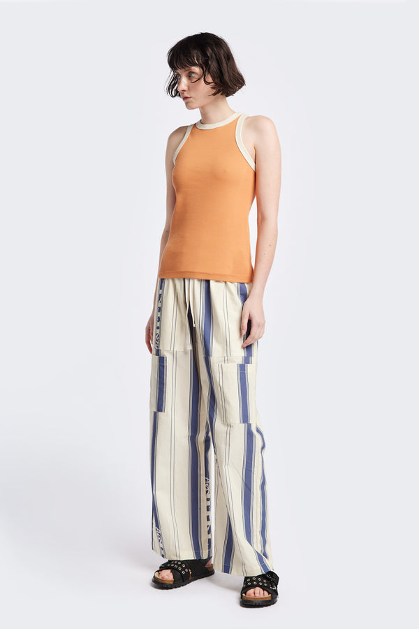 Front of Kloke Flux Racer Back Tank in Pastel Orange and Ecru Japanese ribbed cotton, featuring a slim fit and slight racer neckline, perfect for layering. Available in 5 sizes.