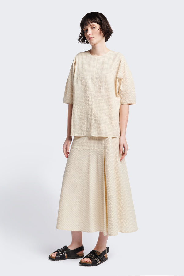 The Geos Panel Top in Ecru beige, textured cotton seersucker with gently shaped sculpted sleeves, perfect for summer. Available in 5 sizes.