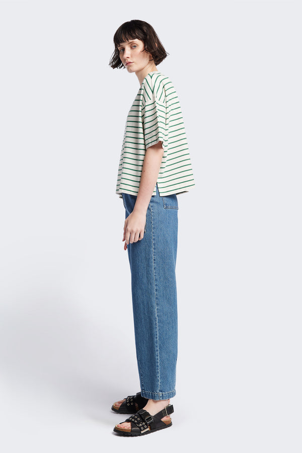 Side of The Interval Jean in Mid Wash. A well-loved Kloke classic. A straight, wide leg with higher rise waist, back yoke detail, and feature patch pockets. Crafted from premium 12oz Japanese denim. Available in 10 sizes.