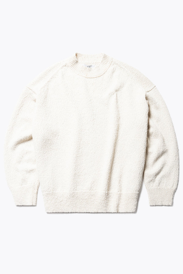 Flat Front of the Ecru Leeway Sweater in a soft chunky cotton knit, featuring an oversized relaxed fit, raglan sleeves, and ribbed hem and cuffs.