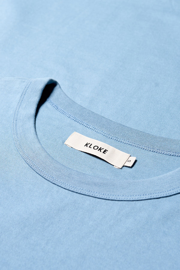 Close-up of 100% organic cotton fabric used in the blue Obelisk Tee