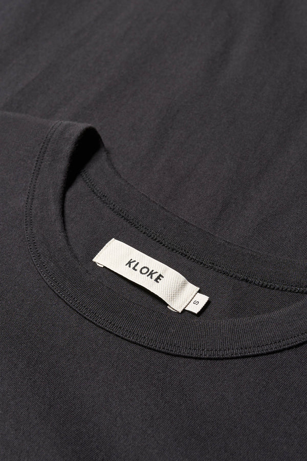 Close-up of 100% organic cotton fabric used in the black Obelisk Tee