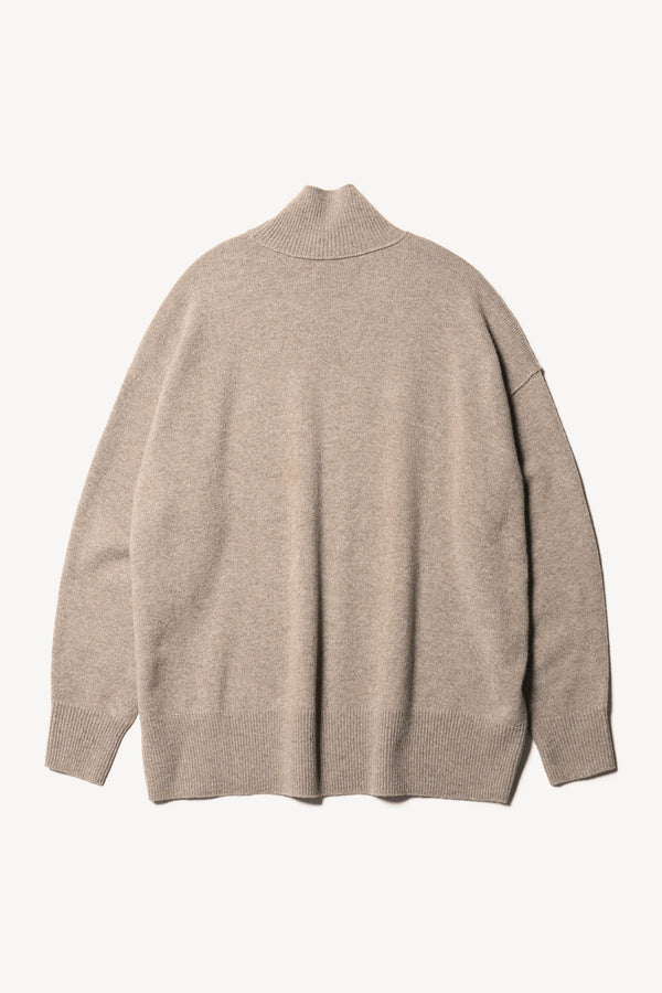 Flat back of the Overflow long knit, high neck wool blend sweater with exposed seams in taupe
