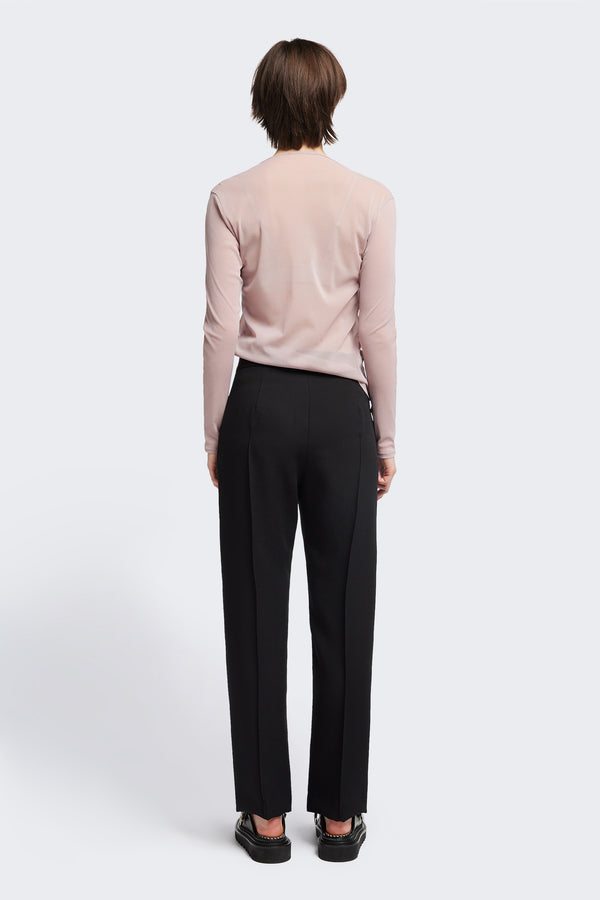 Back of the Rein Mesh Long Sleeve Top in Pale Mauve and Peach. Featuring a high neckline, contrast flatlock seams, and sheer, lightweight fabric, perfect for layering.