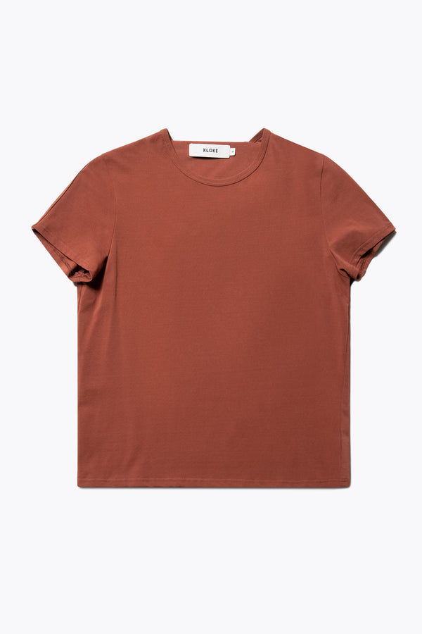 Flat Front view of the Ride Short Sleeve top in Brick. A crew neck jersey top in Japanese cotton stretch with cap sleeves.