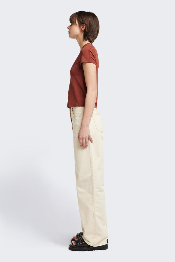 Side view of the Ride Short Sleeve top in Brick. A crew neck jersey top in Japanese cotton stretch with cap sleeves.