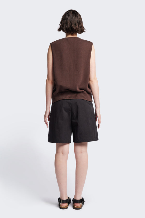 Back of the Ritual Vest in Brown soft cotton rib, featuring a shallow V-neckline and centre front button placket. A versatile trans-seasonal layering piece, available in 5 sizes.