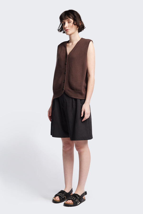The Ritual Vest in Brown soft cotton rib, featuring a shallow V-neckline and centre front button placket. A versatile trans-seasonal layering piece, available in 5 sizes.