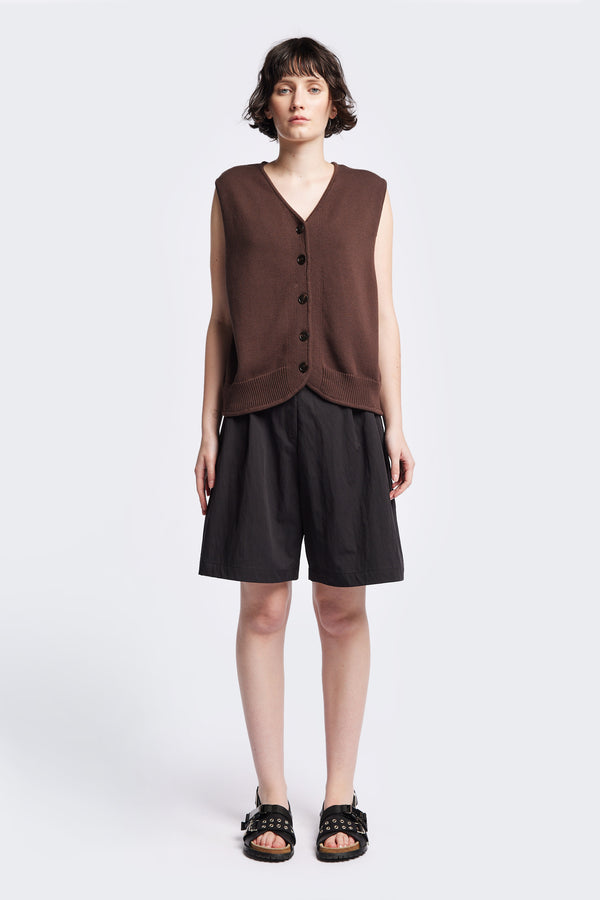 The Ritual Vest in Brown soft cotton rib, featuring a shallow V-neckline and centre front button placket. A versatile trans-seasonal layering piece, available in 5 sizes.