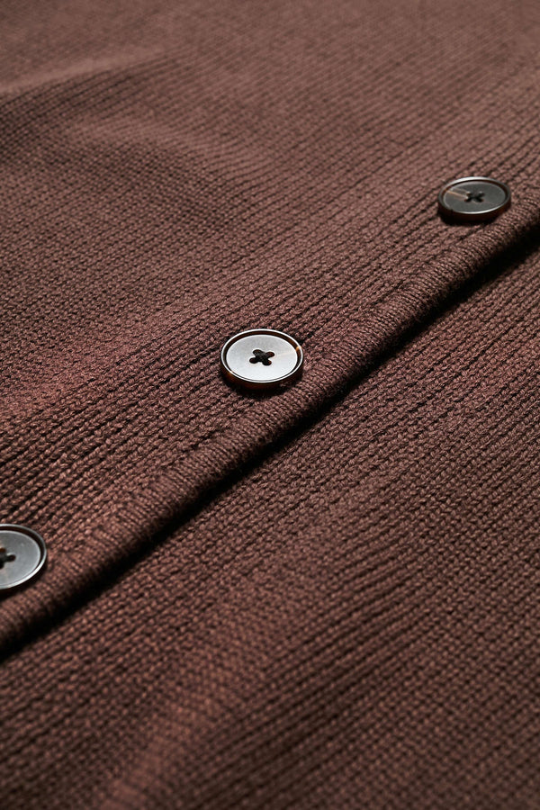 Close up fabric shot of the Ritual Vest in Brown soft cotton rib, featuring a shallow V-neckline and centre front button placket. A versatile trans-seasonal layering piece, available in 5 sizes.