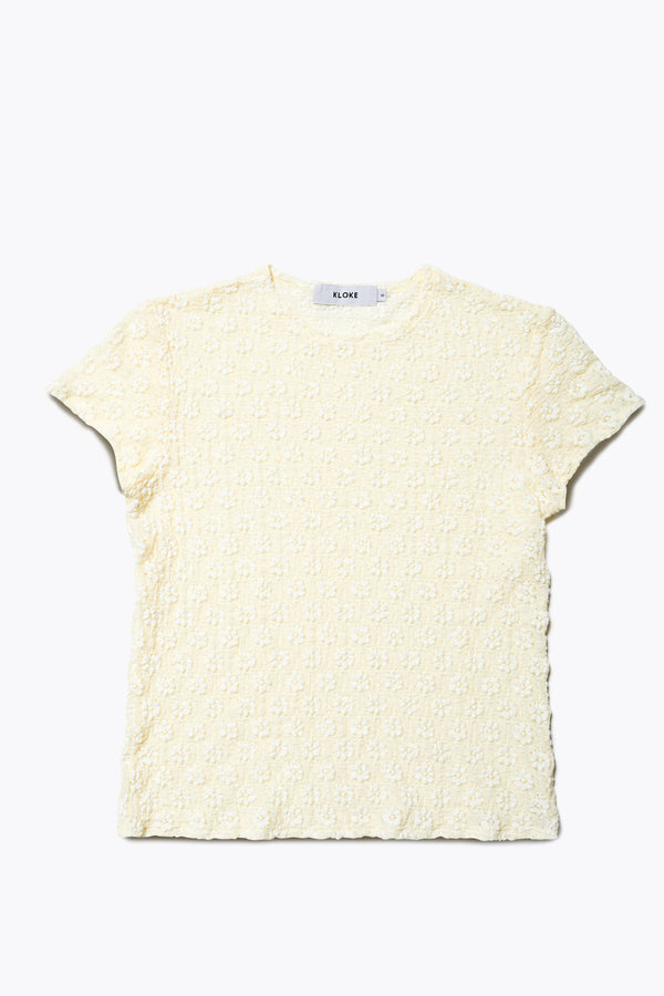 Flat front of Ruse Top in Cream, slim fit with cap sleeves and a flower motif, made from soft cotton with added stretch for comfort. Available in 6 sizes.