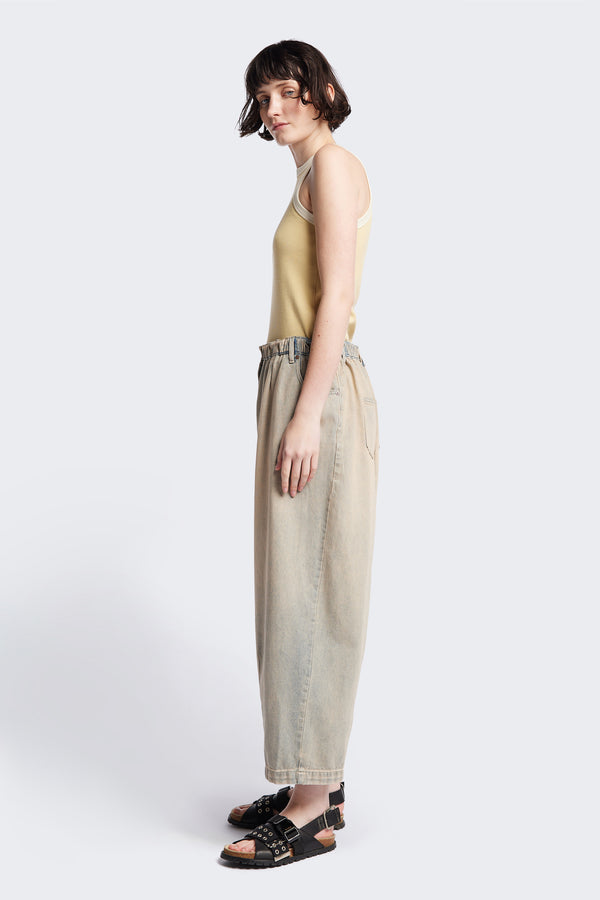 Side of the Tunnel Denim Pant in Blue Pink Fade, with a relaxed fit, wide tapered leg, and elasticated waistband, made from lightweight Japanese cotton denim. Available in 5 sizes.