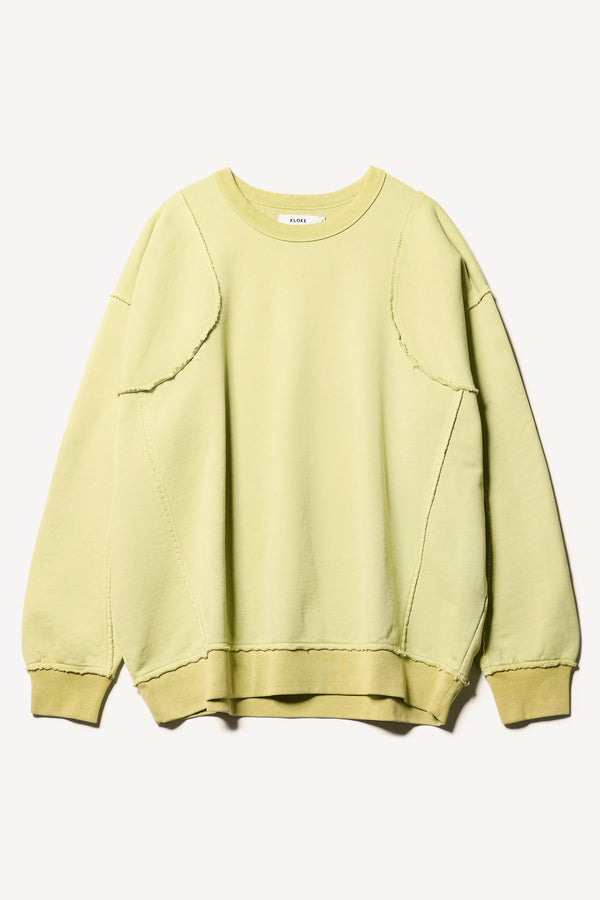 flat front of Unisex format oversized crew neck sweater in chartreuse with clean panelled design and raw flat-locked seams, displayed from the front.
