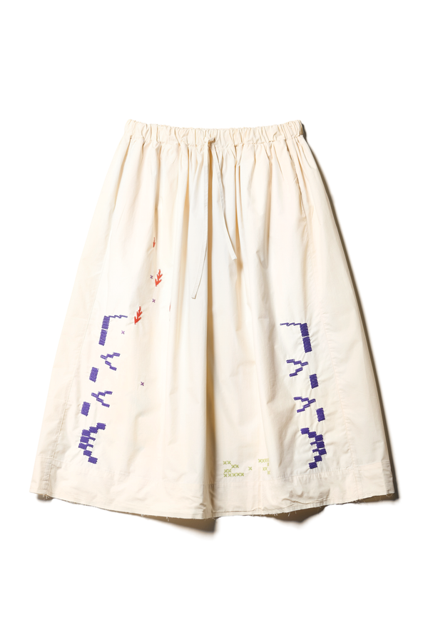 Flat front view of the Ecru Universe Embroidered Skirt showcasing Arecibo-inspired motifs.