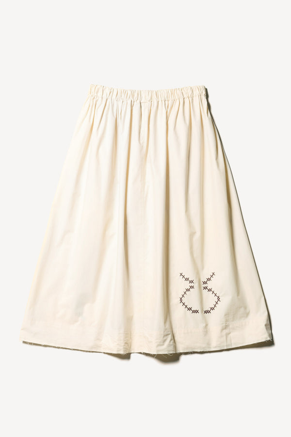 Flat back view of the Ecru Universe Embroidered Skirt showcasing Arecibo-inspired motifs.