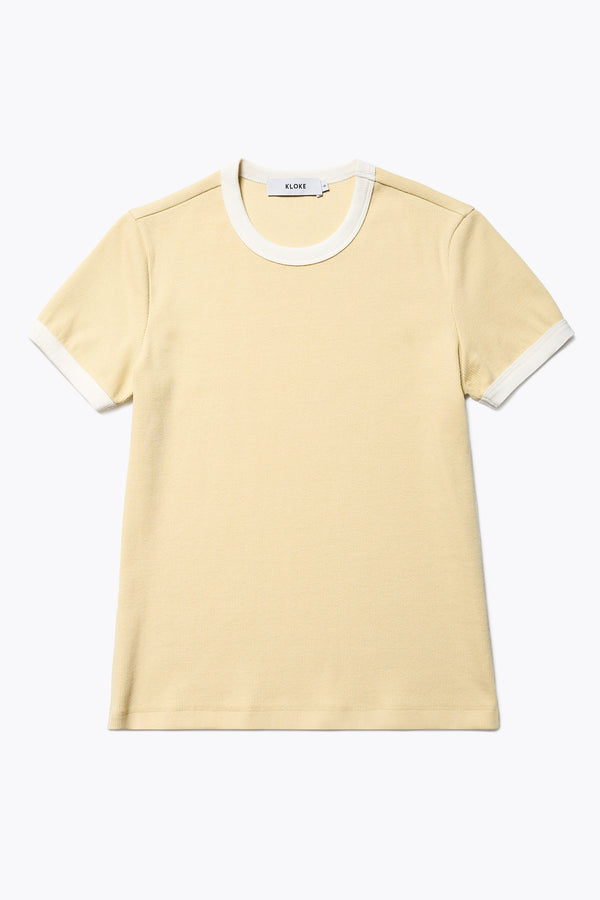 Flat Front of the Veil Rib Tee a slim-fit ringer tee in ribbed cotton, featuring a vintage 70's-inspired design with contrasting neckline and sleeve details. Available in 5 sizes.