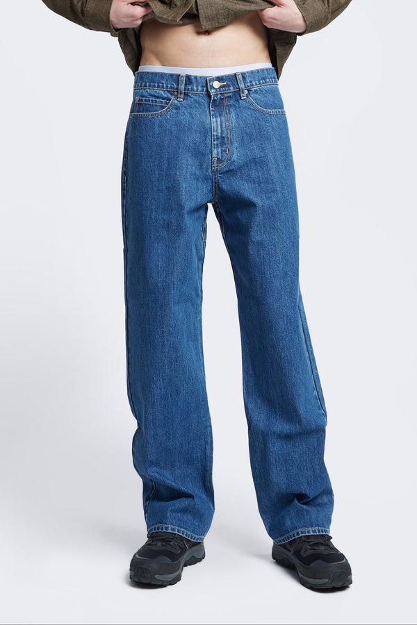 The sworn denim jean in Mid Wash Blue. Looser fit all-purpose jeans in premium Japanese denim with zip fly, button closure, five-pocket design, and Kloke branded hardware. Available in 8 sizes.