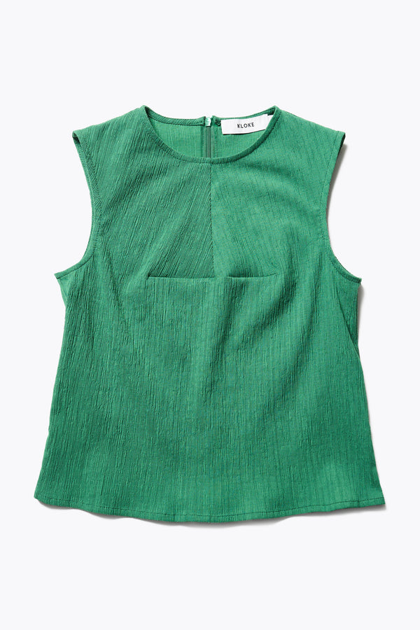 Aeon Crinkle Top in Green, featuring a sleeveless design, panelled bustline, high neckline, and concealed back zip. Crafted from structured crinkled crepe fabric. Available in 4 sizes.